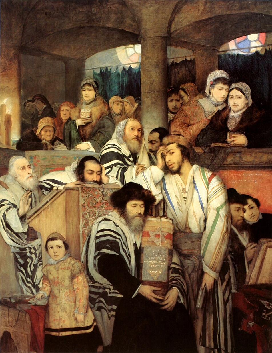 An oil painting of a crowded synagogue interior on Yom Kippur: men in prayer shawls fill the foreground around a seated elder holding a Torah scroll, while women look on from a balcony behind. The artist painted himself into the scene.