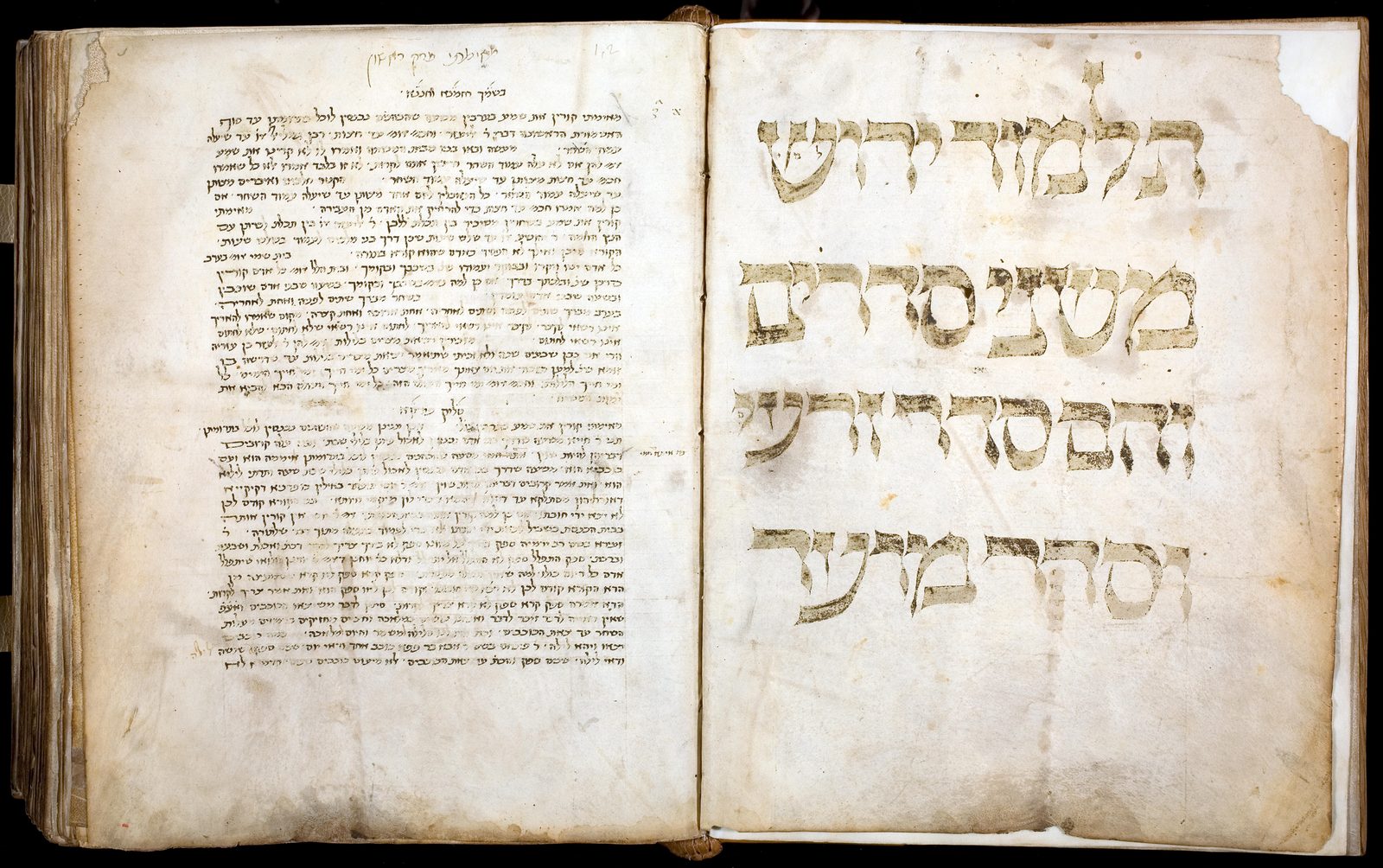 A page of the handwritten Leiden manuscript of the Palestinian Talmud, dense columns of Hebrew and Aramaic script on aged parchment.