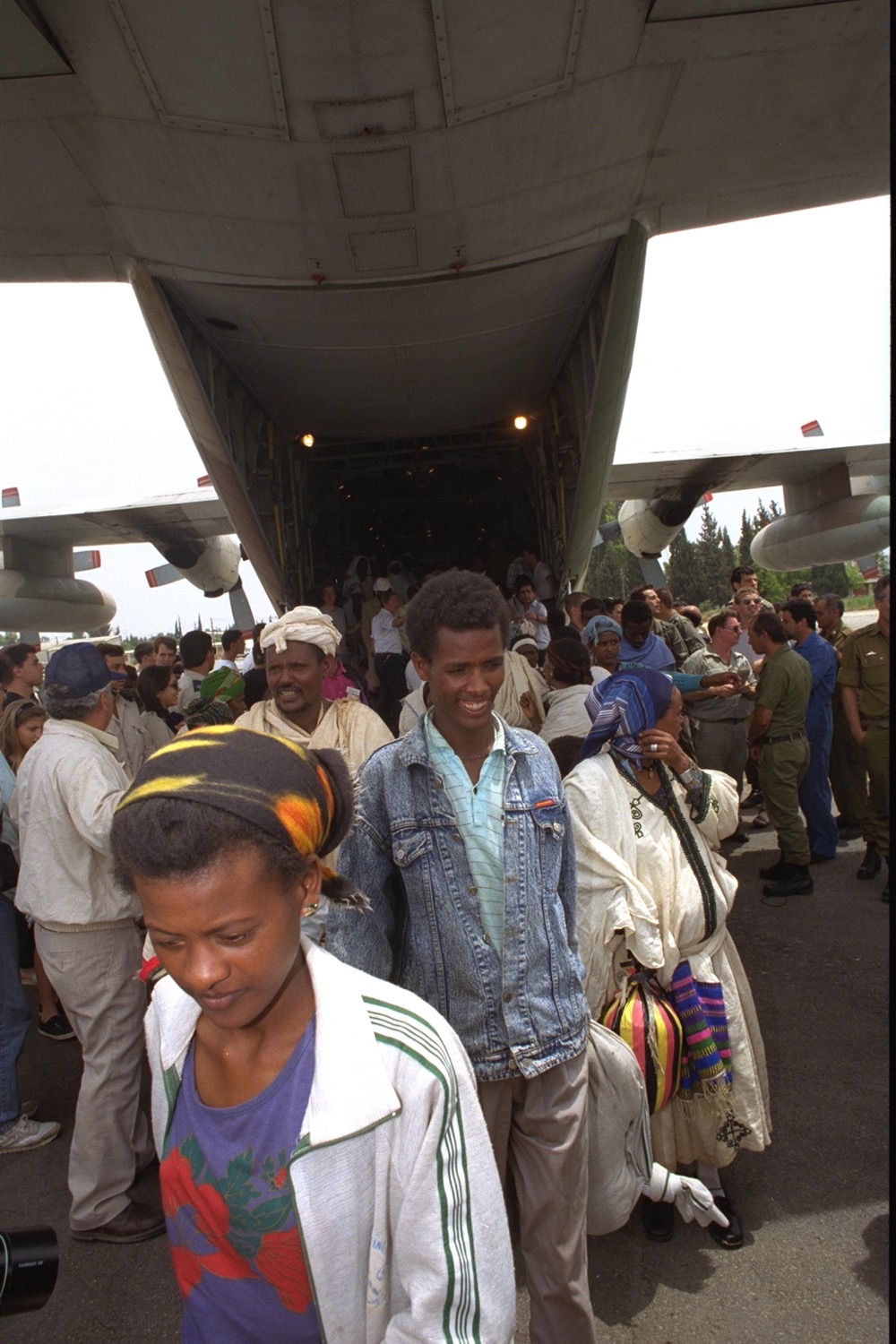 Ethiopian Jews stepping off a military transport plane in Israel, 1991