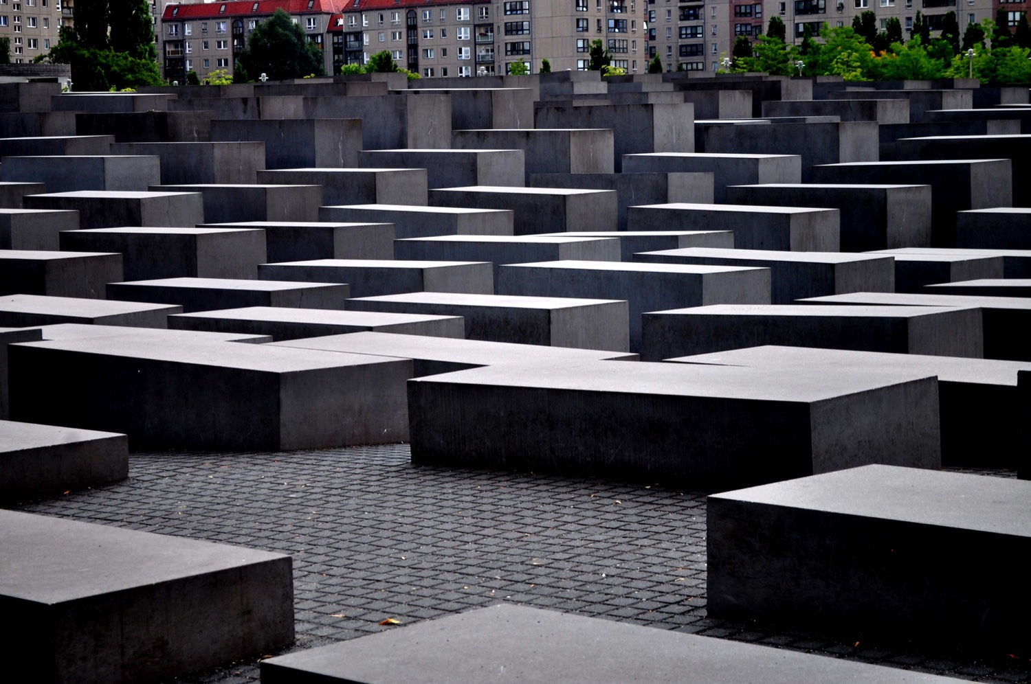 The field of grey concrete stelae of Berlin's Memorial to the Murdered Jews of Europe, blocks of varying heights extending into the distance