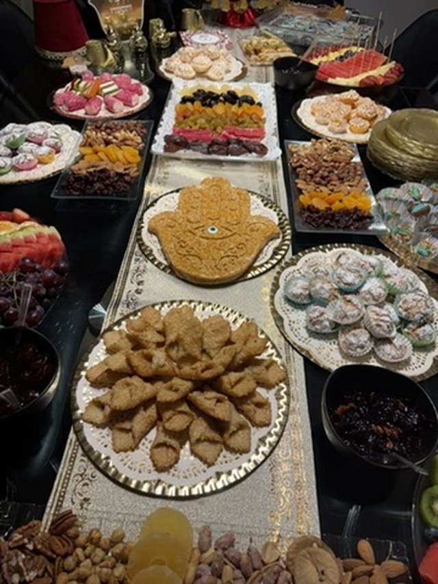 A Moroccan Jewish Mimouna table laid with pastries, sweets, and dried fruit
