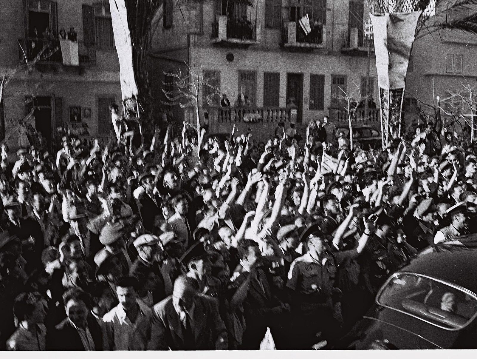 Crowds filling a Tel Aviv street celebrating the declaration of the State of Israel, 14 May 1948