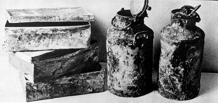 Metal milk cans and tin boxes of the kind used to bury the Oneg Shabbat archive in the Warsaw Ghetto.