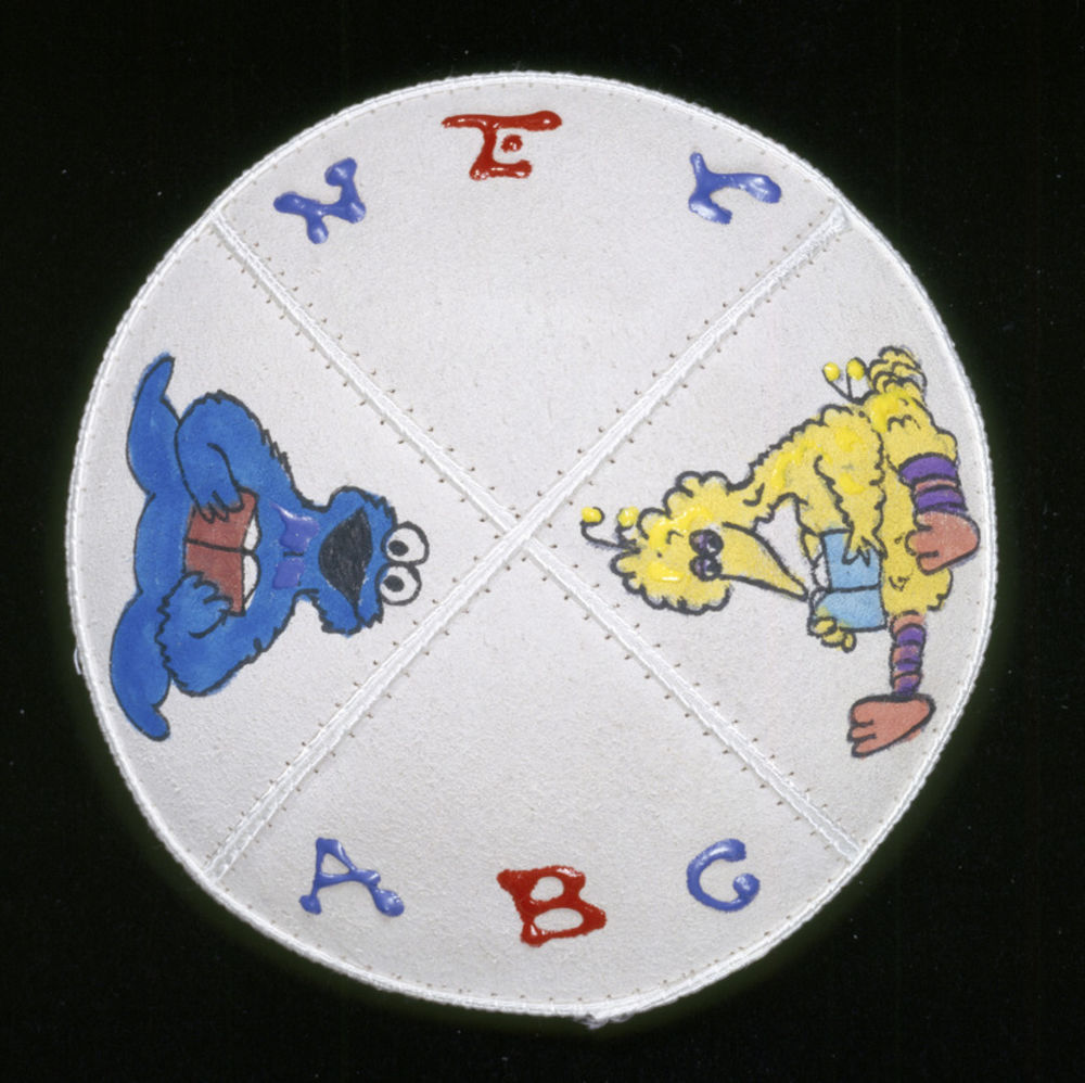 A skullcap (kippah) hand-painted in acrylic on leather