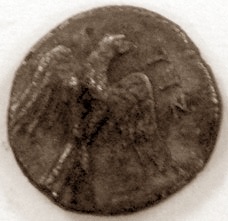 A small silver Yehud coin showing a falcon